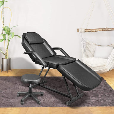 OmySalon 73in Facial Massage Bed Adjustable Spa Bed Tattoo Chair w/Barber Stool Black Front Left View Image of Bed In Use 